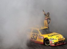 Clint Bowyer celebrates his first win in 88 NASCAR Sprint Cup Series starts by doing a burnout and saluting the fans on Sunday at the New Hampshire Motor Speedway in Loudon, N.H., the first race in the Chase for the NASCAR Sprint Cup. Credit: Gregg Ellman-Pool/Getty Images
